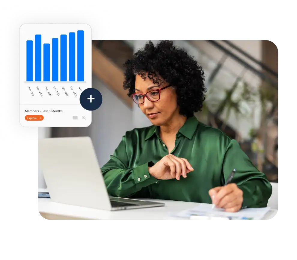 woman marking up chart printouts