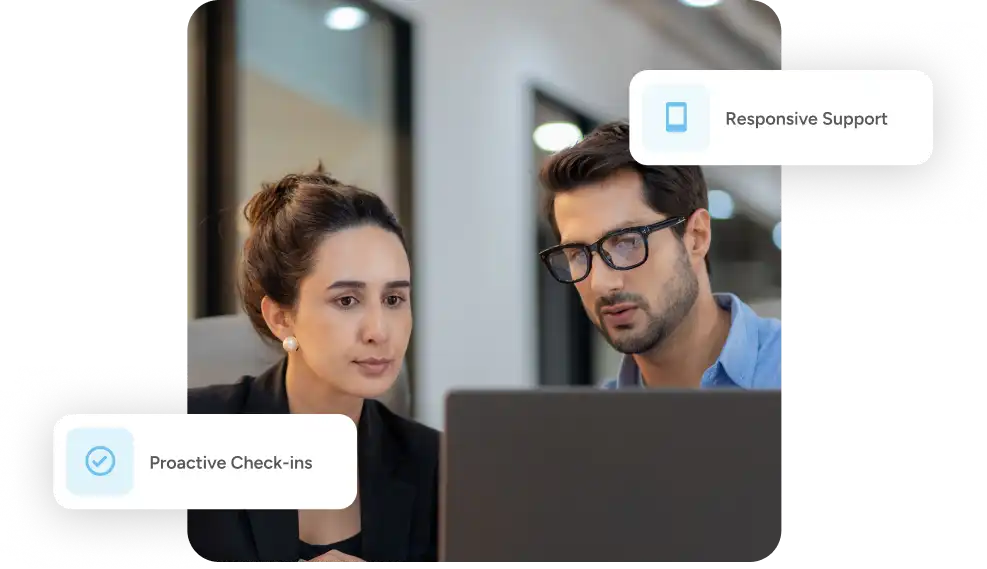 man and woman look at a laptop together behind the tooltips 'responsive support' and 'proactive check-ins'