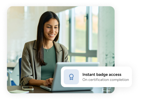 woman types on a laptop behind an 'instant badge access' tooltip