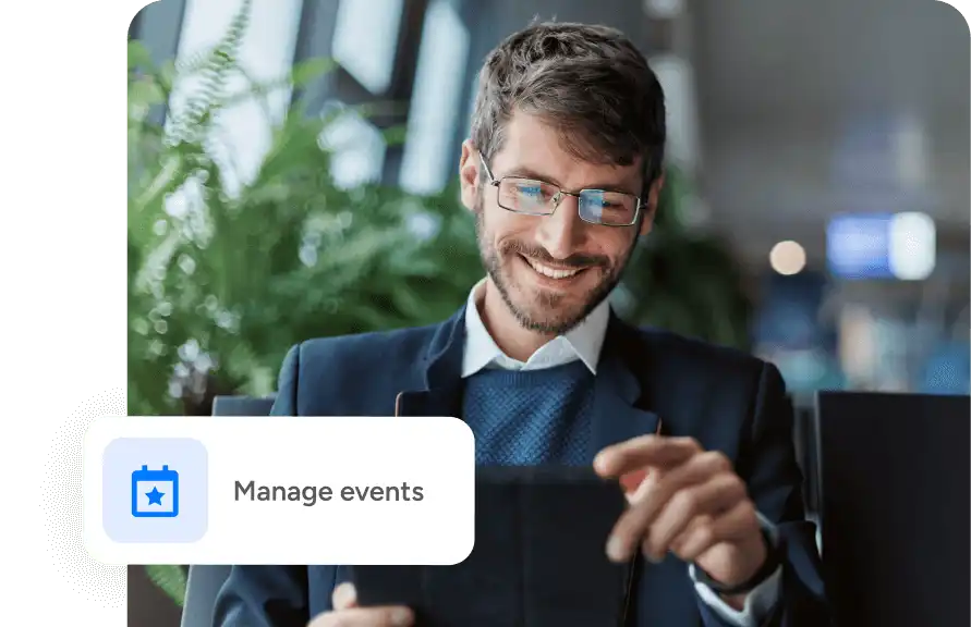 man working on a computer, with a "manage events" button floating over