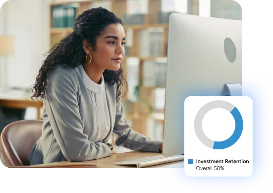 woman working on a computer at her desk