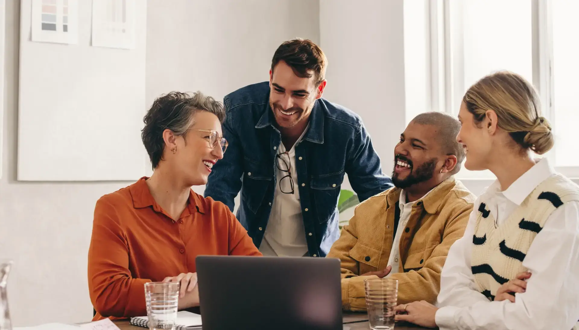 happy colleagues smiling together