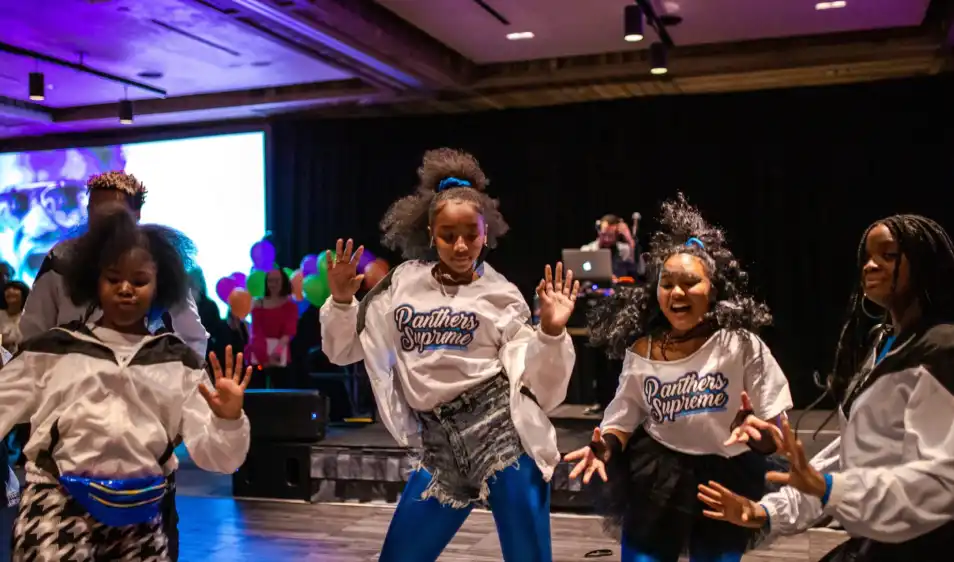 girls dance in matching shirts
