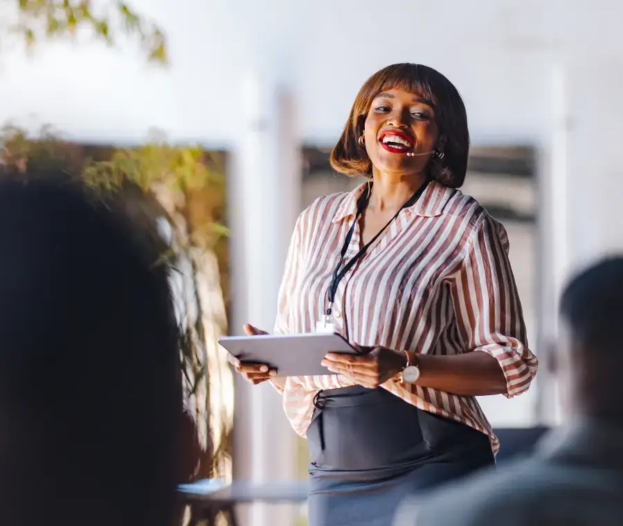 Event speaker happily presenting at a conference.